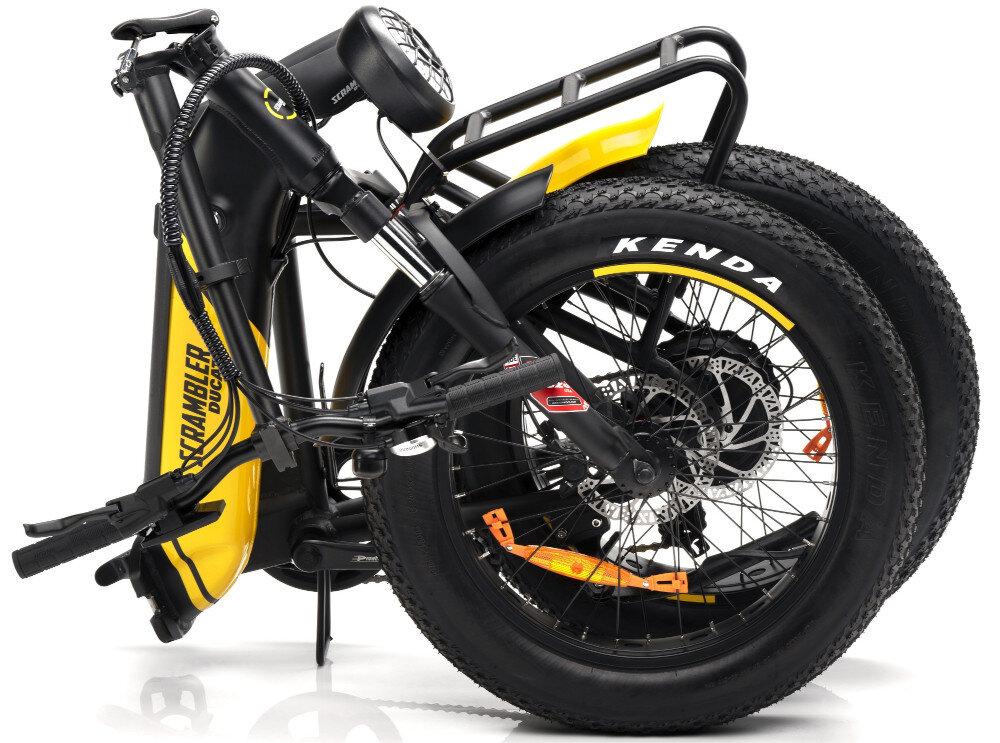 Rower elektryczny DUCATI Scrambler SCR-X U17 20 cali Czarno-żółty złożony rower na białym tle składna rama szybkie i łatwe zmniejszenie jego wymiarów nie wpływa na wytrzymałość i stabilność bezpieczne prowadzenie w każdych warunkach mobilność elastyczność komfort przechowywania