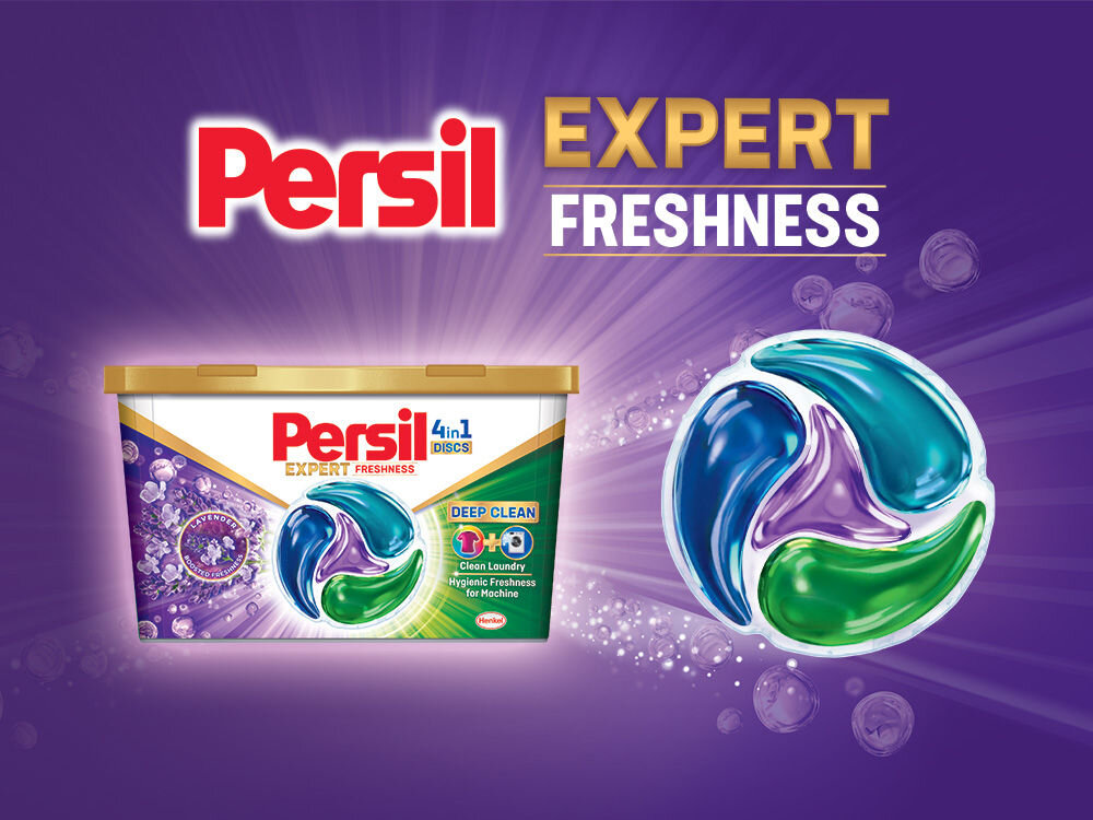Kapsułki do prania PERSIL Reklama kapsułek Persil 4in1 Discs Expert Freshness. Duże opakowanie kapsułek na fioletowym tle z promieniami światła i lawendą. Obok w powiększeniu widoczna jedna kapsułka o barwach niebiesko-fioletowo-zielonej. Hasło główne: Persil Expert Freshness