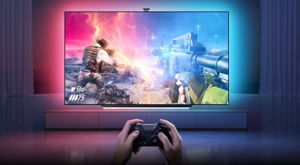 Taśma LED GOVEE H605C 3.6 m Wi-Fi/Bluetooth, TV, krawędź, grawitacyjnym, kalibracja, zamocowanie, osoba gra w grę na tv w asyście działających taśm LED za tv