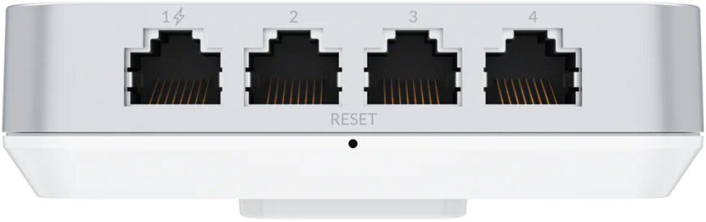 Punkt dostępu UBIQUITI U6-IW Zbliżenie na dolny panel obudowy zawierający cztery ponumerowane porty LAN oraz fizyczny przycisk resetowania