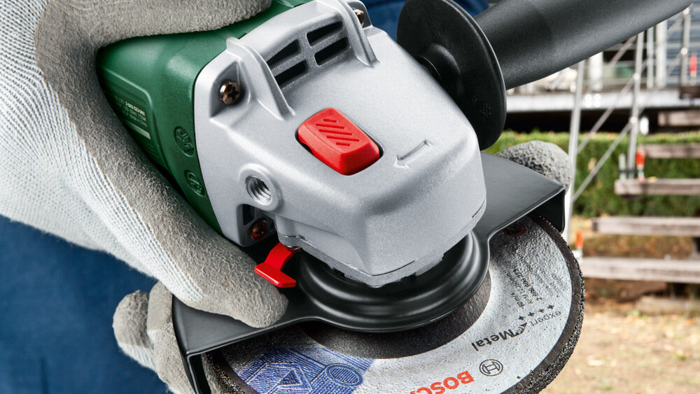 Szlifierka kątowa BOSCH UniversalGrind 750-125 przycisk blokady wrzeciona M14 szybka zmiana tarczy beznarzedziowa tarcza o srednicy 125 mm