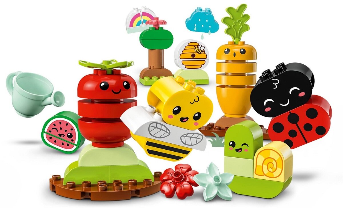 LEGO DUPLO Ogród uprawowy 10984 dziecko kreatywność zabawa nauka rozwój klocki figurki minifigurki jakość tradycja konstrukcja nauka wyobraźnia role jakość bezpieczeństwo wyobraźnia budowanie pasja hobby funkcje instrukcja aplikacja LEGO Builder pomidore marchewka arbuz deszczowa chmura tęcza drzewa kwiaty biedronka pszczoła ul konewka
