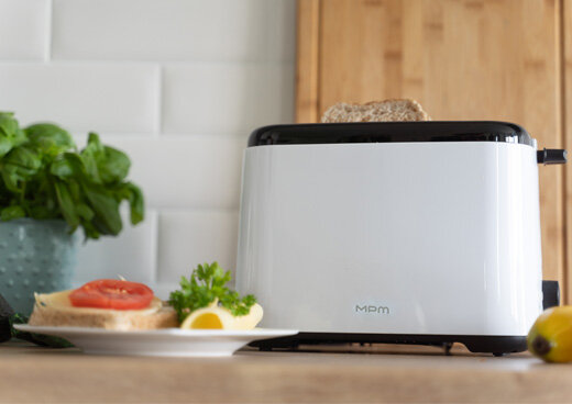 Zbliżenie na przyciski rozmrażania i podgrzewania w tosterze  MTO-07.