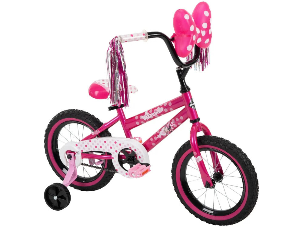 Rower dziecięcy HUFFY Disney Minnie 14 cali dla dziewczynki Różowy rower na białym tle widoczny z boku pod skosem zdjęcie na białym tle podstawa bezpieczeństwa intuicyjny system pedałowy cofnąć pedały w początkowej fazie nauki jazdy