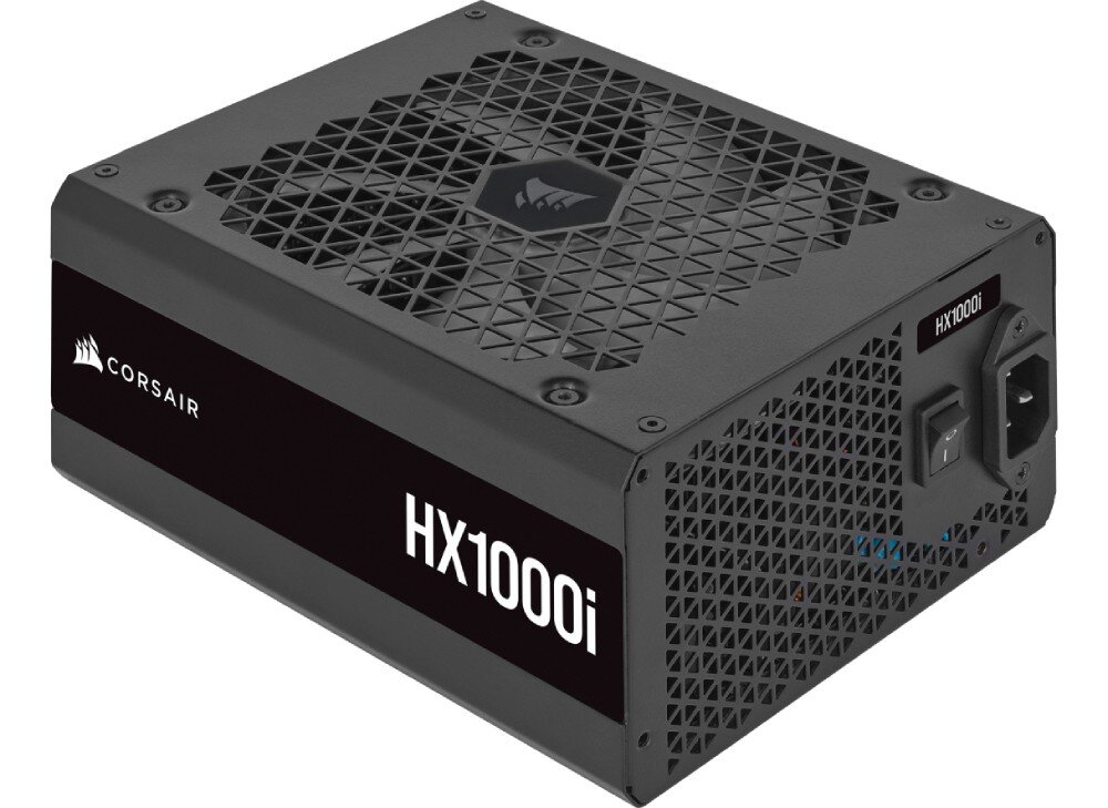 Zasilacz CORSAIR HX1000i Zasilacz komputerowy widoczny pod lekkim kątem z kratką wentylacyjną, gniazdem zasilania i oznaczeniem 'HX1000i' na boku