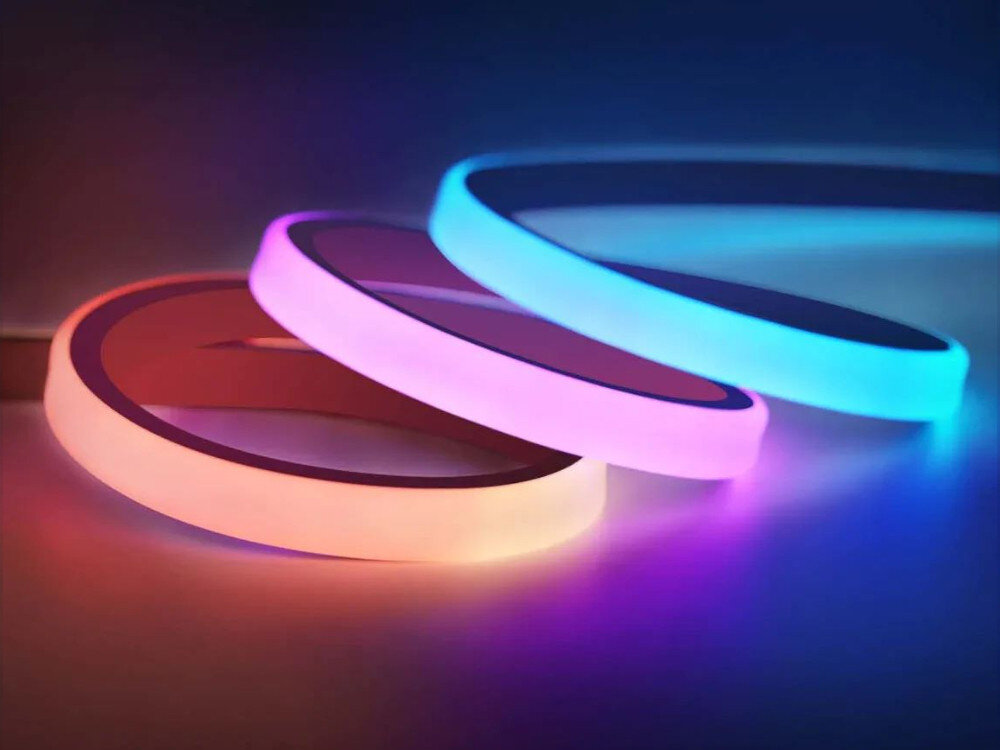 Taśma LED GOVEE H61C3 3m Wi-Fi/Bluetooth, 3m, silikon, RGBIC, segmenty, Trzy elastyczne taśmy LED w różnych kolorach na białym tle.