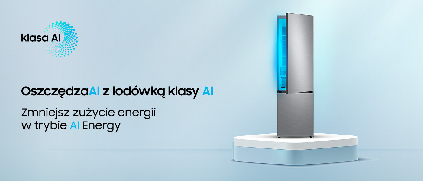 Obraz przedstawia lodówkę w kolorze szczotkowanej stali nierdzewnej na białym postumencie. Tekst na obrazie: \'klasa AI Oszczędzaj z lodówką klasy AI Zmniejsz zużycie energii w trybie AI Energy\'.