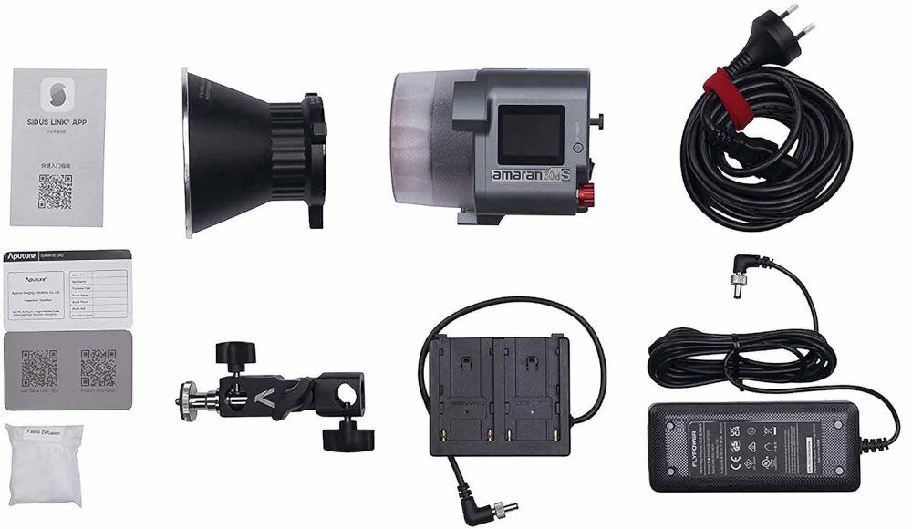 Lampa LED AMARAN COB 60D S mocowanie Bowens, wrota, reflektory, softboxy, otwór montażowy na parasolkę, osłona diody LED, czasza, dyfuzor, trzpień z gwintem 1/4, przegubowy adapter montażowy, adapter zasilania na 2 akumulatory NP-F, zasilacz, kabel zasilający, walizka transportowa, instrukcja obsługi oraz karta gwarancyjna