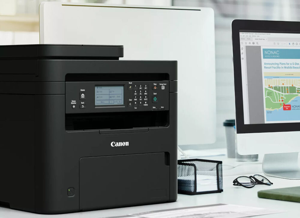 Urządzenie wielofunkcyjne CANON i-SENSYS MF275dw Automatyczny druk dwustronny, Wi-Fi prezentacja urządzenia na biurku obok monitora