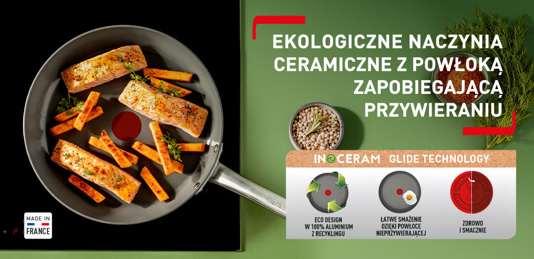Patelnia TEFAL Renew+ C4240253 z jedzeniem na płycie kuchennej, obok przyprawy. Apla z funkcjami patelni.