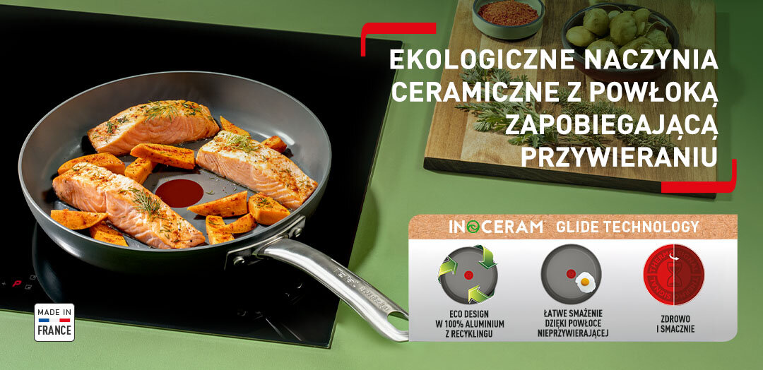 Patelnia TEFAL Renew+ C4240643 z jedzeniem na płycie kuchennej, obok drewniana deska z przyprawami. Apla z funkcjami patelni.