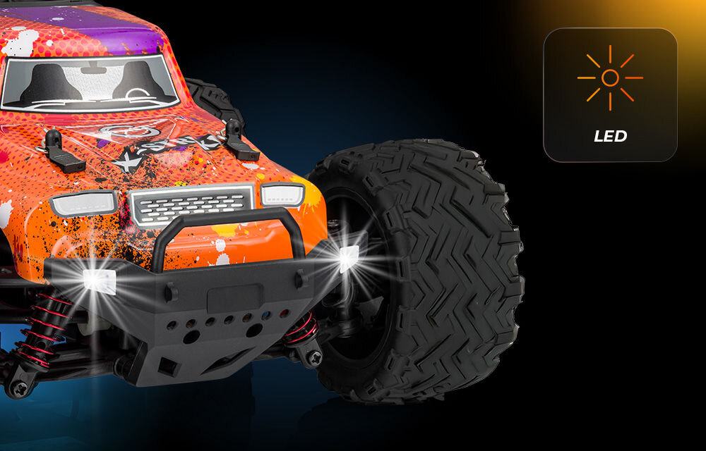 Samochód zdalnie sterowany OVERMAX X-Strike Bardzo bliskie ujęcie przedniego koła i przodu pomarańczowo-czerwonego samochodu RC X-Strike. Dwa małe, białe światła LED są włączone. W prawym górnym rogu ikona słońca z napisem LED