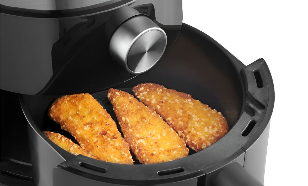 Air Fryer Frytkownica beztłuszczowa CONCEPT FR2500 frytkownica otwarta kosz pokrętło potrawa w koszu panierka mięso uchwyt białe tło szeroki zakres regulacji temperatury od 80 do 200°C dostosowanie parametrów timer (1-30 minut) automatycznie wyłącza urządzenie wygoda i bezpieczeństwo moc 1200 W efektywne działanie optymalne zużycie energii praktyczne rozwiązania dla każdego zdrowe i szybkie gotowanie