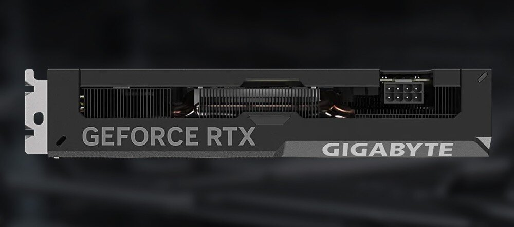 Karta graficzna GIGABYTE GeForce RTX 4060 Ti WindForce OC 8GB Widok karty graficznej z boku, na którym widać radiator, rurki cieplne i złącze zasilania 8-pin, montaż, bezpieczeństwo