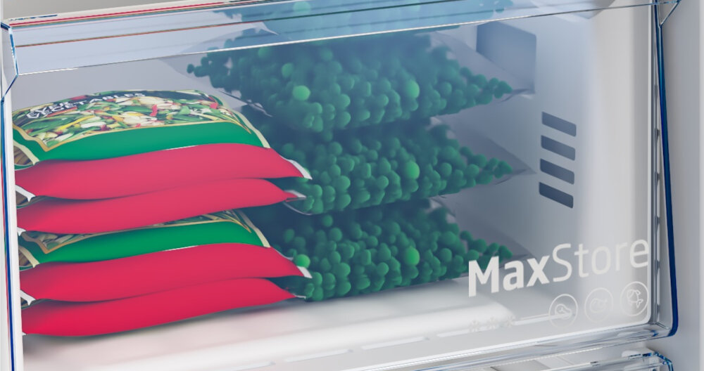 ZAMRAŻARKA BEKO B5RFNE274W Zbliżenie na szufladę MaxStore przeznaczoną do przechowywania większych produktów. W środku widoczne są opakowania mrożonych warzyw szybkie mrożenie świeżość żywności ochrona produktów