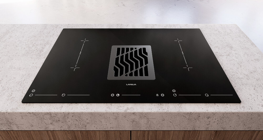 PŁYTA INDUKCYJNA LANILIA VILIO 80.1 Zdjęcie przedstawia płytę grzewczą z wbudowanym wyciągiem umieszczoną na jasnym blacie o kamiennej strukturze, tworzącą uporządkowany i estetyczny element kuchni. Symetryczny układ pól grzewczych oraz centralny wyciąg podkreślają funkcjonalność i wygodę użytkowania klasa A+ energooszczędna płyta oszczędność środowisko skuteczne usuwanie zapachów