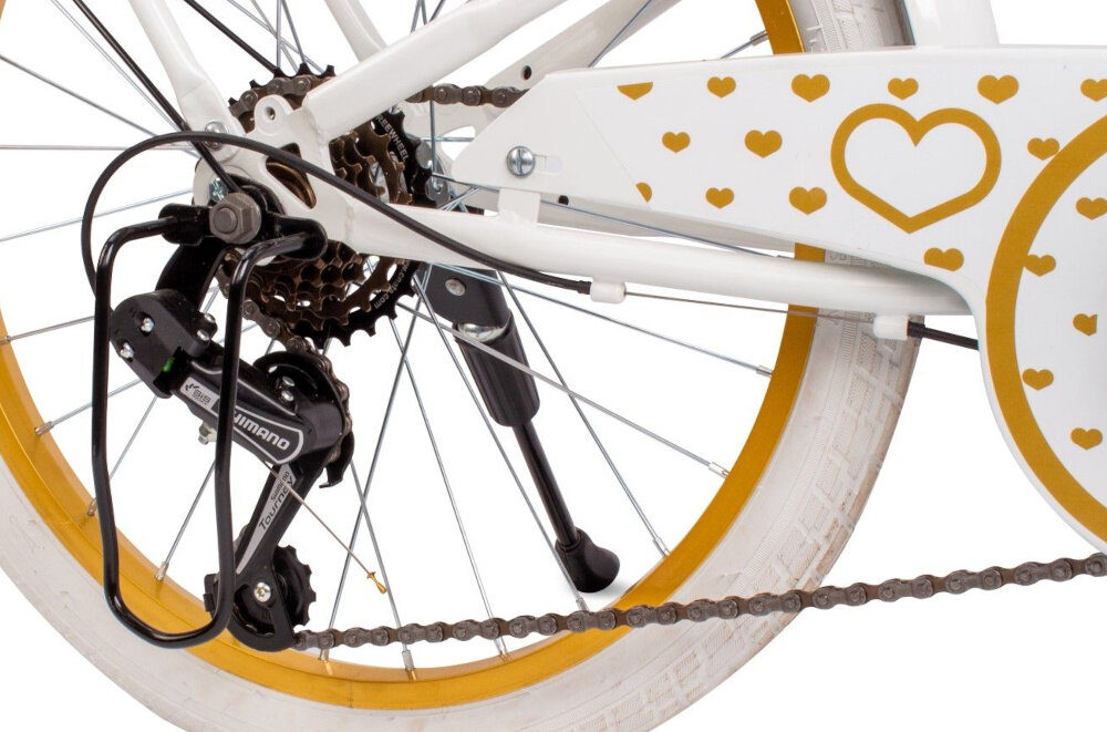Rower dziecięcy SUN BABY Heart bike 20 cali dla dziewczynki Biało-złoty 6 biegow obrotowa manetka RevoShift tylna przerzutka SHIMANO Tourney duza wytrzymalosc sprawne dzialanie plynna bezproblemowa zmiana biegow