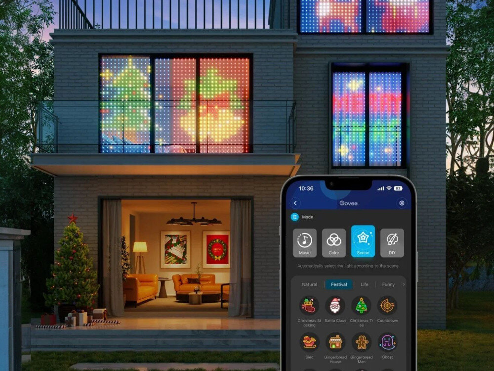 Kurtyna dekoracyjna GOVEE H70B1 520 LED 2 Sieciowe 2 m Transparentny, kreatywność, aplikacja, kolory, wzory, Elewacja domu z kilkoma oknami ozdobionymi kurtynami LED wyświetlającymi świąteczne motywy oraz zbliżeniem na ekran smartfona z aplikacją GOVEE do sterowania efektami świetlnymi.