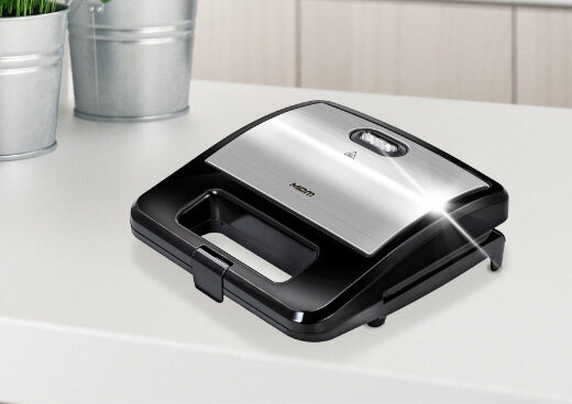 Opiekacz MOP-48M z połyskującą obudową.