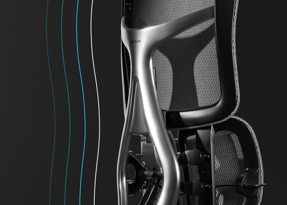 Fotel DIABLO CHAIRS Brave V-Kinetic Czarny prezentacja fotela od tyłu pod kątem pokazanie jego konstrukcji na ciemnym tle design AluFrame Streamline aluminium połyskujący smukła konstrukcja ergonomia komfort premium