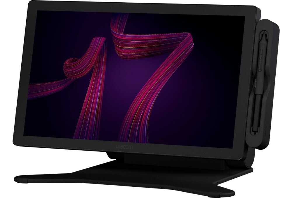 Tablet graficzny WACOM Cintiq Pro 17 Tablet graficzny ustawiony na stojaku z dołączonym rysikiem. Ekran wyświetla wzór w fioletowych i różowych liniach. Tablet stoi na czarnej podstawce, mocowanie VESA gwinty akcesoria stolik