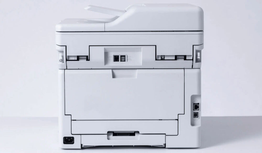 Urządzenie wielofunkcyjne BROTHER MFC-L3740CDW Druk w kolorze, Automatyczny druk dwustronny, Wi-Fi prezentacja urządzenia od tyłu na jasnym tle prędkość druku tryb monochromatyczny kolor eliminacja długiego czasu oczekiwania czas potrzebny na wydruk pierwszej strony