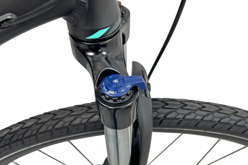 Rower crossowy INDIANA X-Cross 3.0 D19 damski Czarno-turkusowy przednie amortyzator marki HL Corp typ CH-187 HLO 700C Disc ulatwia najezdzanie na przeszkody niweluje wstrzasy na kierownicy