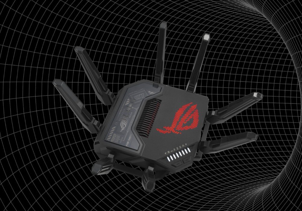 Router ASUS ROG Rapture GT-BE98 Router z czerwonym podświetleniem logo widoczny pod kątem na tle czarnej siatki przestrzennej, zastosowanie, strumienie Wi-Fi, technologia Multi-Link