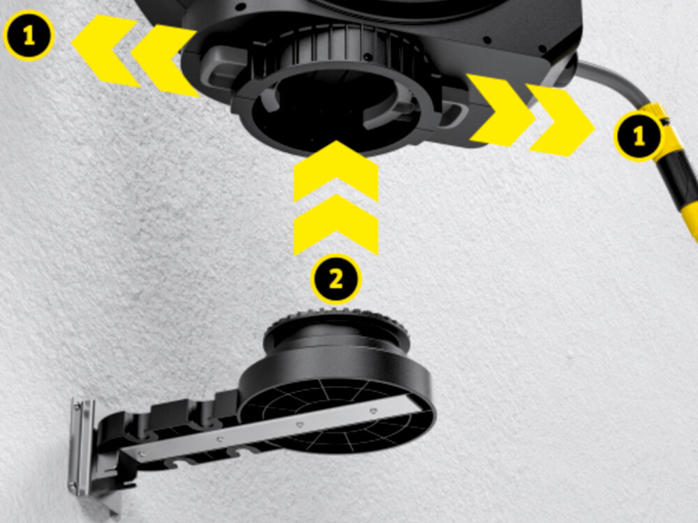 Bęben na wąż KARCHER HBX 5.35 Automatic jasna ściana budynku zbliżenie na obudowę zbliżenie na system montażu wytrzymały zdejmowany uchwyt ścienny z metalowym rdzeniem stabilność rozstaw śrub 79 mm i płyta montażowa 93 × 100 mm solidne zamocowanie możliwość zdjęcia skrzynki