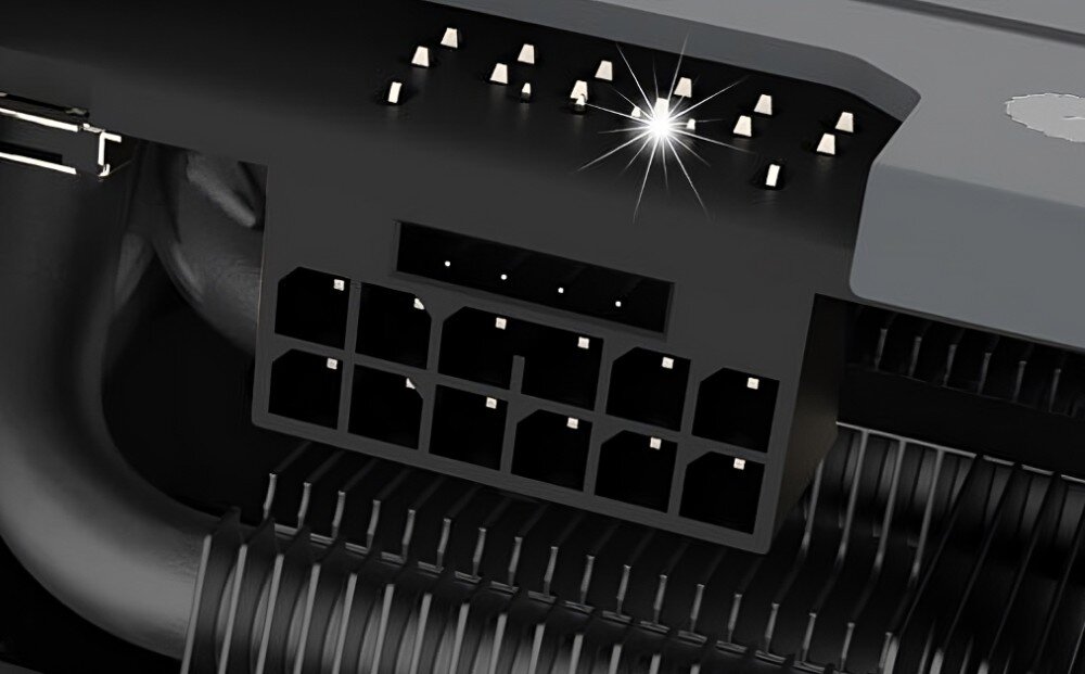Karta graficzna GIGABYTE GeForce RTX 4070 Ti Super Eagle OC 16GB Zdjęcie gniazda zasilającego z 16-pinowym złączem PCIe, widoczne detale pinów i fragment radiatora w tle, konstrukcja, trwałość, wskaźnik zasilania