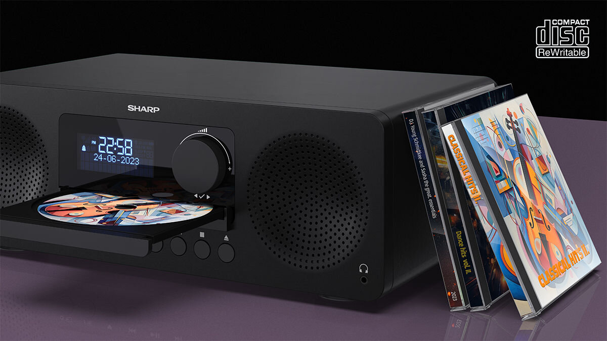 Wieża SHARP XL-B720D z odtwarzaczem CD i obsługą plików MP3, wieża stojąca na blacie z opartymi o nią płytami CD
