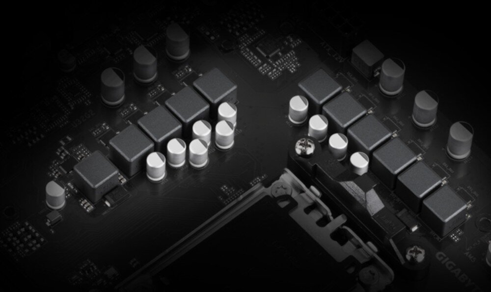 Płyta główna GIGABYTE B650 Gaming X AX V2 Sekcja zasilania płyty głównej z widocznymi cewkami i kondensatorami w rzędach obok gniazda procesora