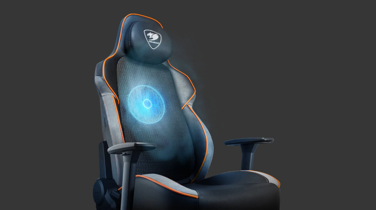 Fotel COUGAR NxSys Aero Czarno-pomarańczowy sportowy charakter wentylator RGB solidna stalowa rama oddychająca skóra PVC magnetyczna poduszka pod głowę