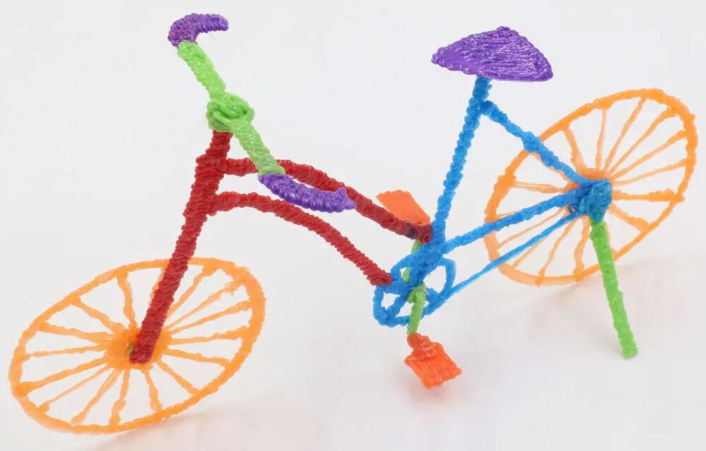 Długopis 3D EXTRALINK Smart Life ABS / PLA, Średnica dyszy 1.75 mm Żółty prezentacja wydrukowanego kolorowego roweru na jasnym tle filament PLA materiał przeznaczenie użytkowanie korzystanie