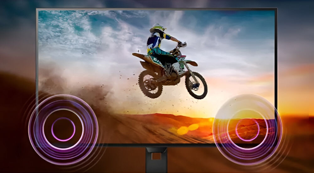 Monitor PHILIPS 24E1N1300A 23.8 cala 1920x1080px IPS 100Hz 1 ms [MPRT] prezentacja monitora od przodu wizualizacja grających głośników na ekranie motocykl cross skaczący nad piaskowymi górkami dwa głośniki 2W bez potrzeby podłączania dodatkowego sprzętu audio