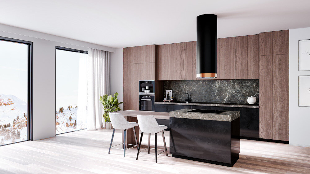 Okap GLOBALO Heweno Isola 39.2 Czarny miedziany mat Na zdjęciu widoczny jest czarny czarny okap kuchenny o cylindrycznym kształcie, zawieszony centralnie nad wyspą, w eleganckim i jasnym wnętrzu z widocznymi schodami, telewizorem i obrazami na ścianie. Całość podkreśla luksusowy charakter kuchni oraz minimalistyczny design