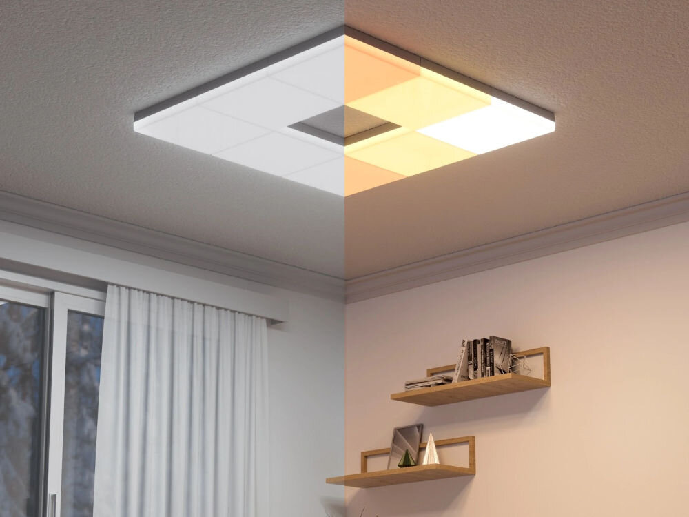 Panele świetlne NANOLEAF Skylight Starter Kit (3 sztuki) wnętrze pokoju z lampą sufitową LED składającą się z kilku kwadratowych paneli z których każdy świeci inaczej