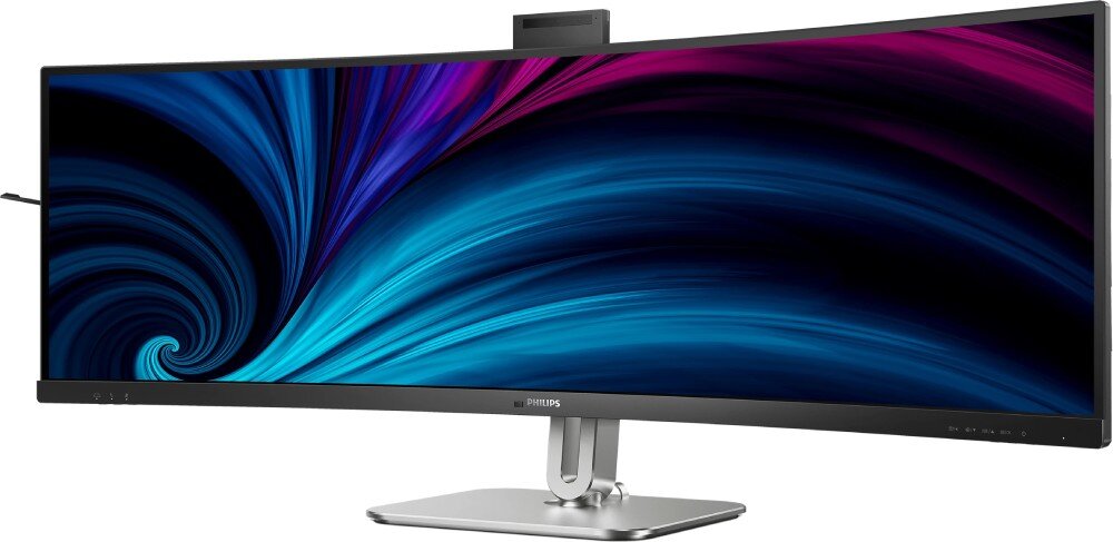 Monitor PHILIPS 49B2U6900CH Zakrzywiony monitor z bardzo szerokim ekranem, wyświetlający dynamiczną, abstrakcyjną grafikę w odcieniach niebieskiego i fioletu. Kamera internetowa jest wysunięta na górnej krawędzi urządzenia, opis