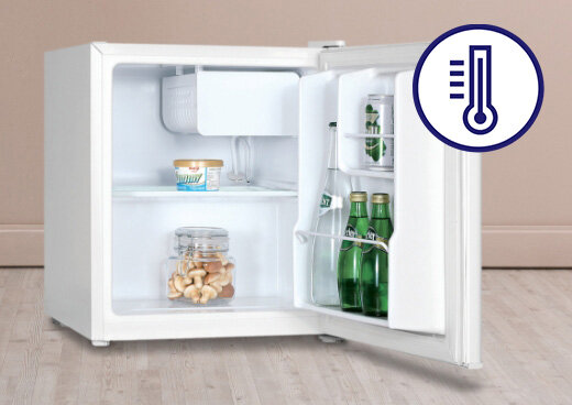 Otwarta lodówka MPM-46-CJ-01/E na podłodze. Wnętrze lodówki wypełnione produktami spożywczymi. Na zdjęciu ikona termostatu.