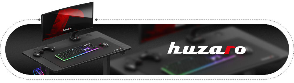 Biurko gamingowe HUZARO Hero 7.9 Czarny prezentacja biurka z akcesoriami na białym tle obok biurka napis huzaro