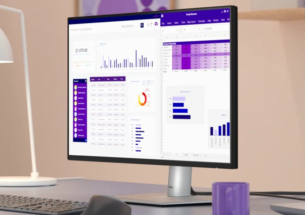 Monitor DELL P2425HE 23.8 1920×1080px IPS 100Hz monitor stojący na biurku z wyświetlonymi tabelkami i wykresem opis