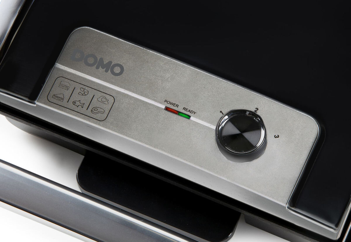 Grill elektryczny DOMO DO9245G, precyzyjna regulacja, szybkie nagrzewanie, lampka kontrolna, wygoda, Zbliżenie na panel sterowania Domo DO9245G, pokrętło z trzema poziomami grzania, wskaźniki stanu pracy, ikony potraw