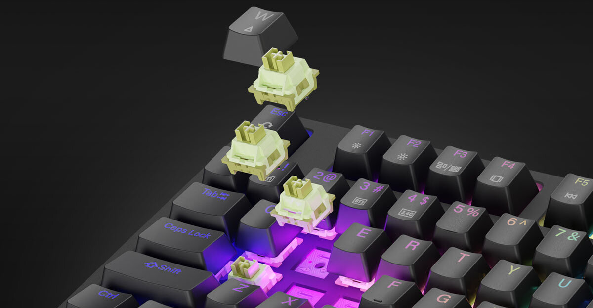 GENESIS Thor 230 TKL Wireless Outemu Silent Lemon technologii Hot-Swap przełączniki 3-pinowe - Klawiatura z widocznymi przełącznikami i zdjętą nakładką z klawisza.