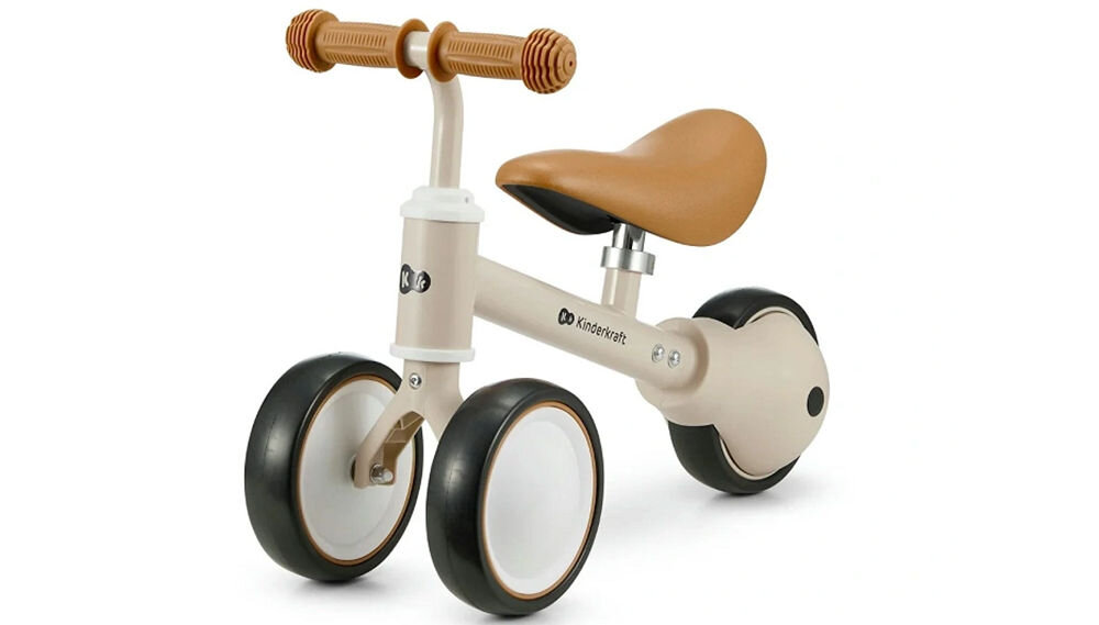 Kinderkraft rowerek biegowy CUTIE LIGHT BEIGE beżowy rowerek biało czarne kółka brązowe siodełko gumowe uchwyty białe tło dla dzieci od 1. roku życia stabilna konstrukcja bezpieczeństwo lekka budowa łatwe prowadzenie rozwijanie samodzielności Kompaktowe rozmiary dostosowany do potrzeb najmłodszych maksymalne obciążenie do 25 kg dla maluchów od pierwszych lat życia