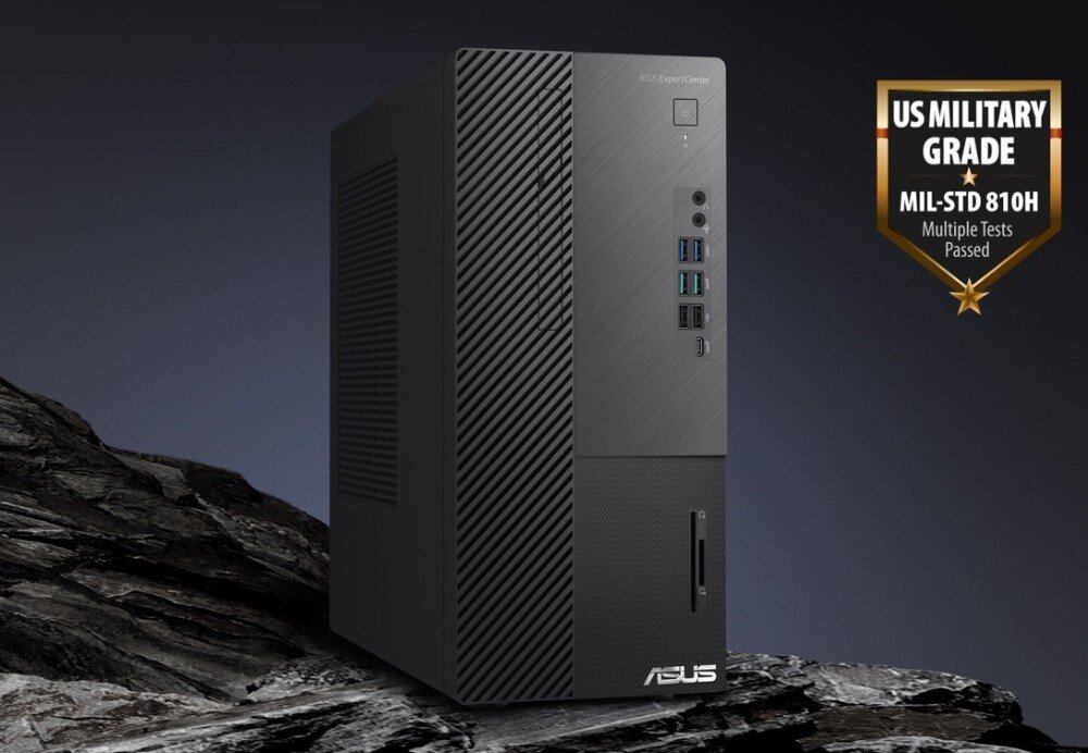 Komputer ASUS ExpertCenter D700ME-513500091X Komputer ASUS ustawiony na skale, na tle ciemnego nieba. Obok plakietka informująca o spełnieniu standardu MIL-STD-810H, wytrzymałość, komponenty, trwałość, żywotność