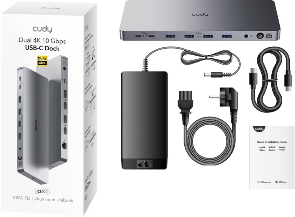 Stacja dokująca CUDY CS700 Zestaw sprzedażowy zawierający stację dokującą, zasilacz, kabel zasilający, kabel USB-C oraz instrukcję obsługi. Obok znajduje się opakowanie z grafiką i specyfikacją urządzenia, opakowanie, zestaw