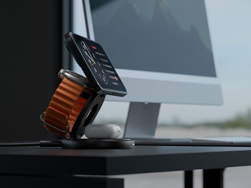 Ładowarka indukcyjna ENERGEA Bazic GoMag Gyre 15W Szary MagSafe
                ładowarka obok monitora z podpiętym kablem na niej telefon zegarek i słuchawki