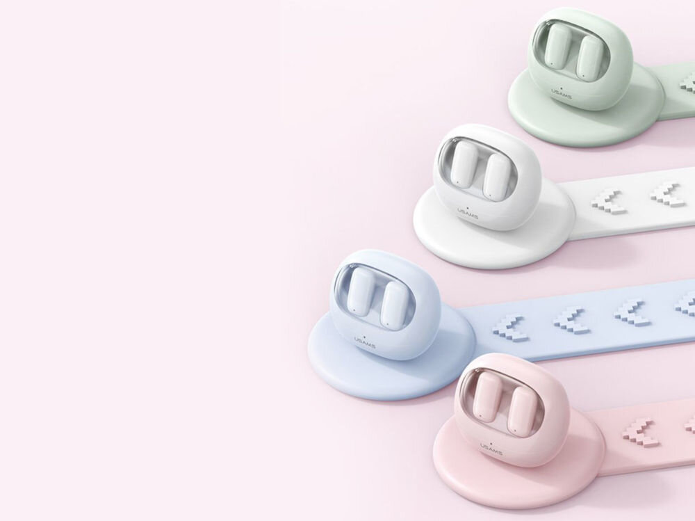 Słuchawki douszne USAMS TD22 Biały Muzyka bez zbędnych kabli różowe tło różne kolory etui na podstawkach zielone białe niebieskie różowe w etui znajdują się słuchawki 