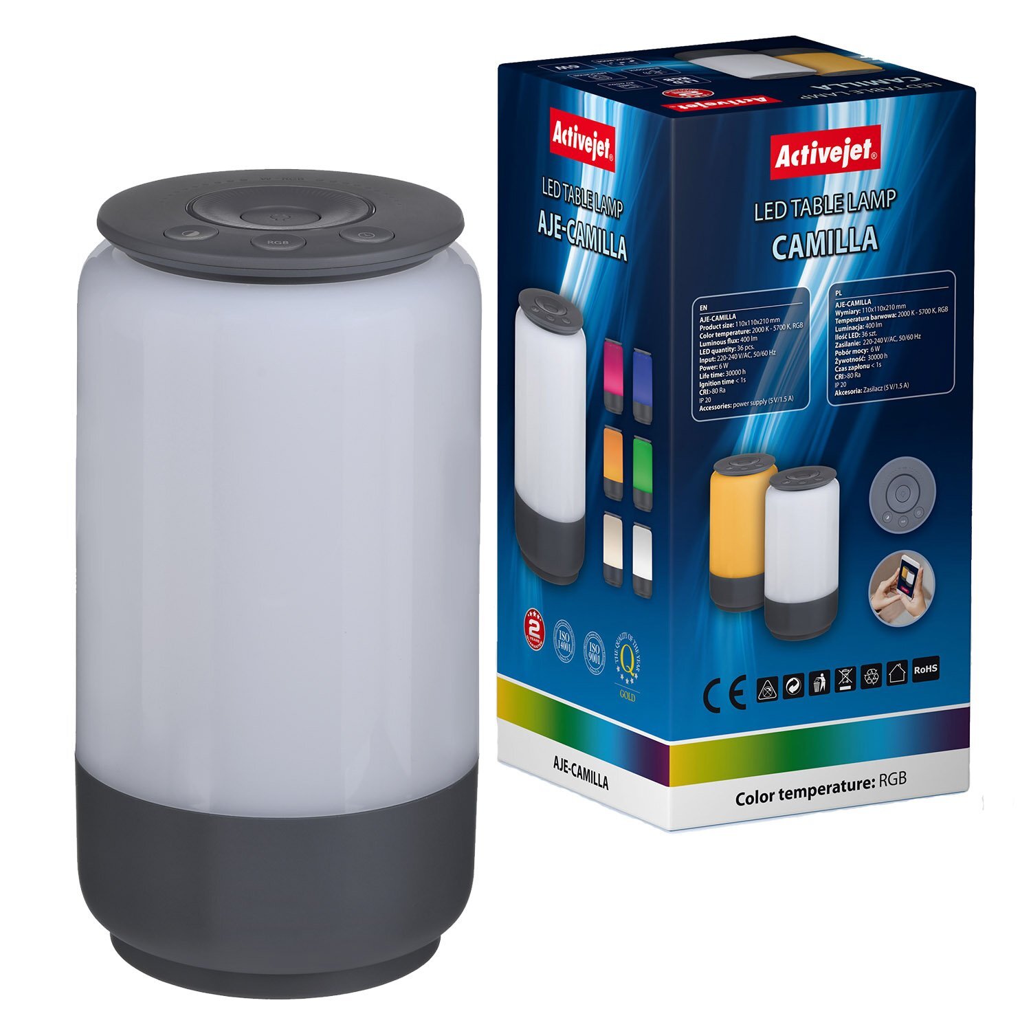 Na obrazie widoczna jest biała lampa stołowa z ciemnoszarym spodem oraz opakowanie z napisem \'Activejet LED Table Lamp AJE-CAMILLA\'. Opakowanie przedstawia różne kolory światła lampy oraz ikony specyfikacji technicznych.