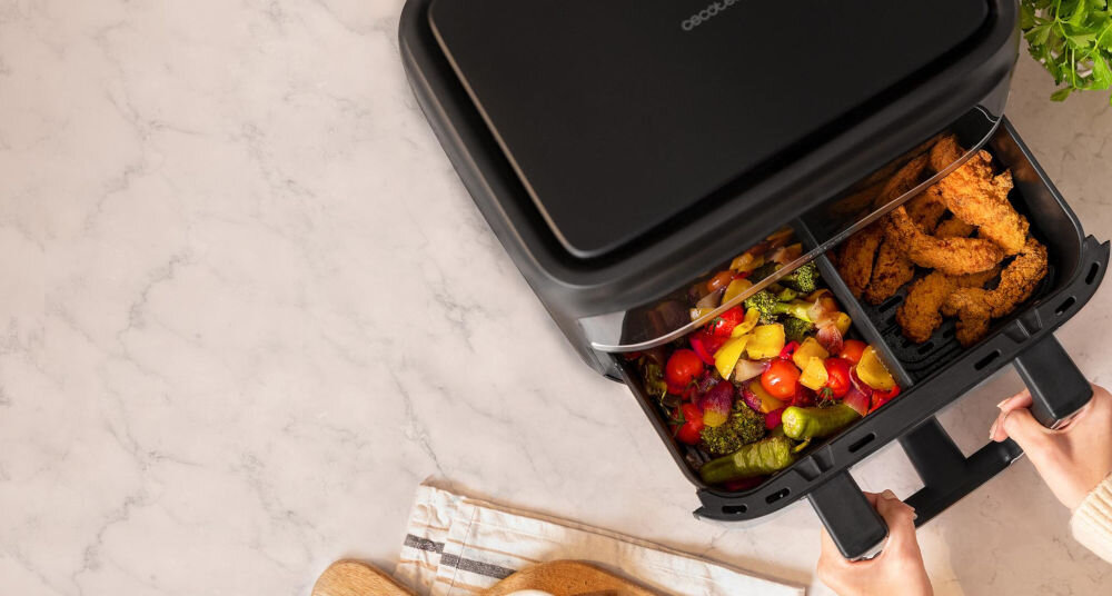 Frytkownica beztłuszczowa CECOTEC Cecofry Dual 9000 Air Fryer kluczowy atut mozliwość podziału na dwie niezqależne komory ścianka podzielenie naczynia na dwie części jednoczesne przygotowywanie dwóch różnych potraw niezalezne ustawienia parametrów wszechstronne i elastyczne gotowanie 